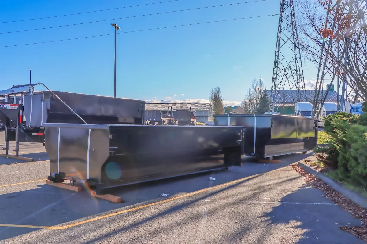 Roll-off dumpster ready for waste disposal at job site for 2 Yard Dumpster Rental in Green